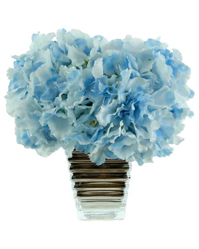 Creative Displays Blue Hydrangeas Arranged In A Silver Glass Vase