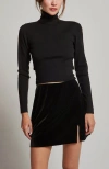 Crescent Turtleneck Tie Back Knit Top In Black