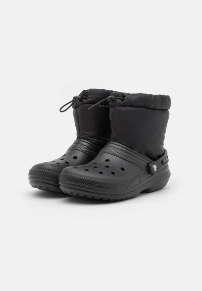 Crocs Women's Classic Lined Neo Puff Boots In Black In Blue