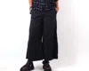 Shop Cut Loose Wide Leg Crop Pants In Black