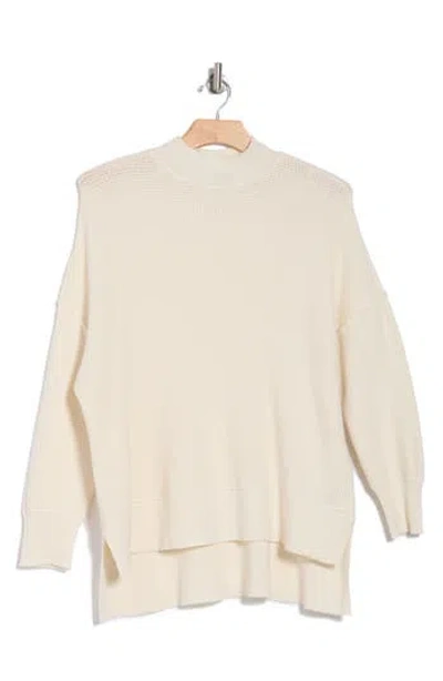 Cyrus Step Hem Waffle Stitch Sweater In Cream