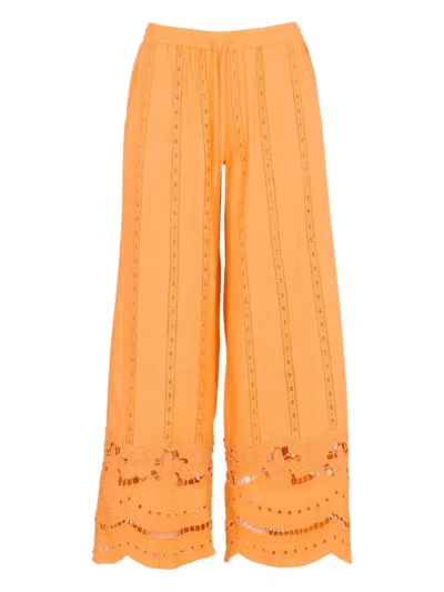 Damson Madder Eyelet-embroidered Trousers In Orange