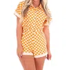 Day + Moon Checkerboard Romper In Orange/ White