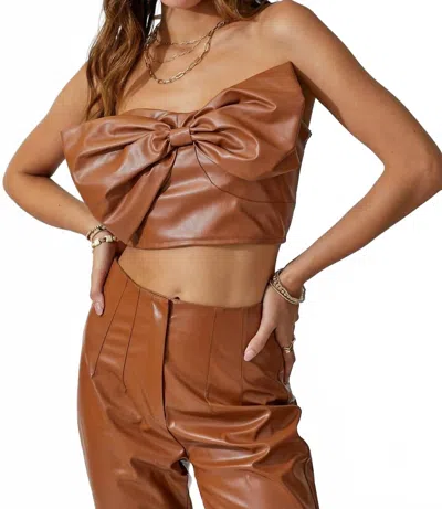 Day + Moon Faux Leather Strapless Bow Top In Caramel In Brown