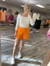 Day + Moon Pleated Linen Shorts In Tangerine