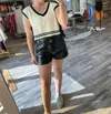 Shop Day + Moon V-neck Contrast & Bow Detail Sweater Vest In Ivory/black