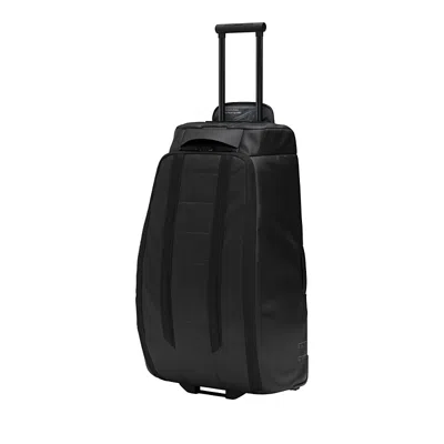 Db Hugger Roller Bag Check In 90l In Black Out