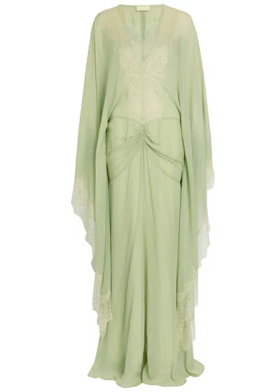 De La Vali Evita Lace-trimmed Draped Georgette Maxi Dress In Green