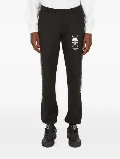 Death Cigarettes Skull Logo Print Trousers In Black