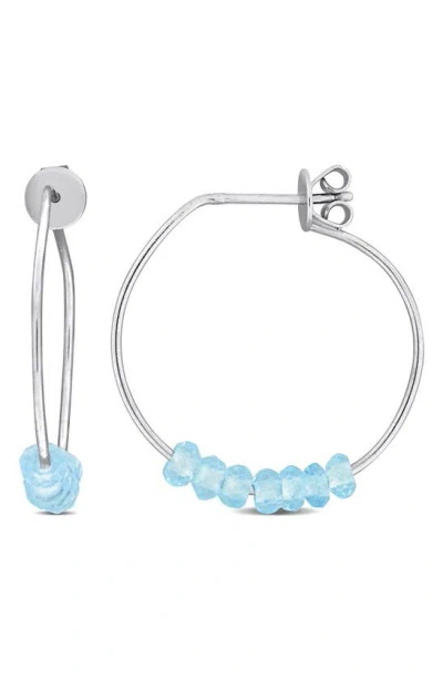 Delmar Faceted Hoop Earrings In Blue Topaz