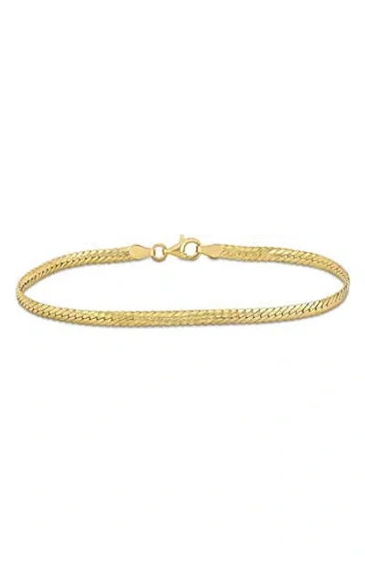 Delmar Herringbone Chain Bracelet In Yellow