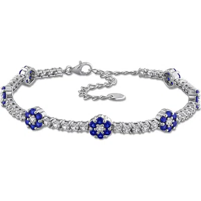 Delmar Sterling Silver Created Sapphire Floral Cluster Line Bracelet In Blue