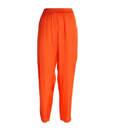 Delos Relaxed Trousers In Orange