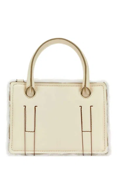 Dentro Handbags.