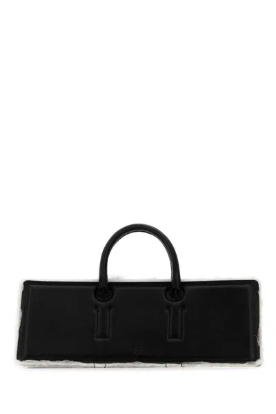 Dentro Handbags. In Black