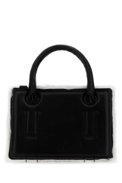 Dentro Handbags. In Black