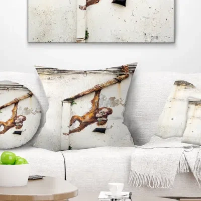 Design Art Baby Orangutan Hanging From Pipe - Street Art Printed Throw Pillow In Brown;white