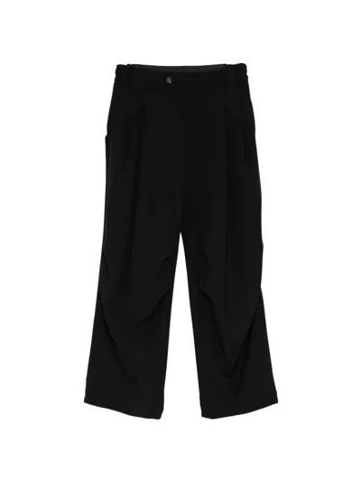 Devoa Pleated Wool Trousers In Black