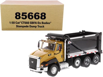 Diecast Masters Cat Caterpillar Ct660 Sbfa With Ox Bodies Stampede Dump Truck Yellow And Black 1/50 Diecast Model By