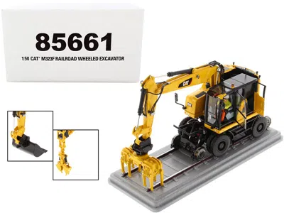 Diecast Masters Cat Caterpillar M323f Railroad Wheeled Excavator With Operator And 3 Work Tools Safety Yellow Versio