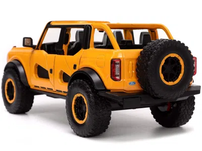 Diecast Model Jada 2021 Ford Bronco Orange Metallic With Extra Wheels "just Trucks" Series 1/24 Diecast Model Car By Ja In Pink
