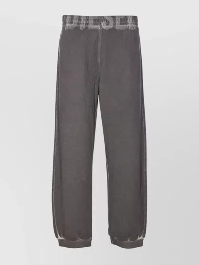 DIESEL TROUSERS WITH PRINTED LATERAL POCKETS AND ELASTICIZED WAIST