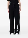 Disclaimer Embellished Drawstring Trousers In Black