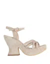 Divine Follie Sandals In Beige