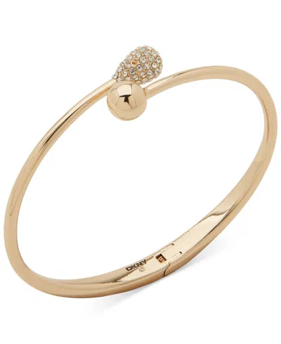 Dkny Gold-tone Crystal Bypass Hinged Cuff Bracelet In Crystal Wh