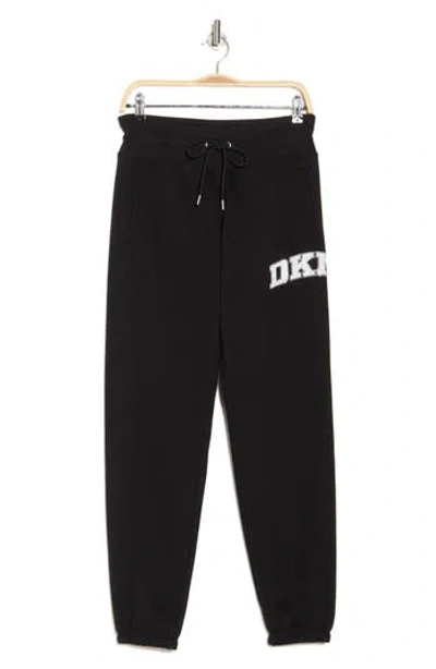 Dkny Rhinestone Arched Logo Joggers In Black/eggnog