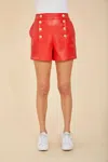 DOLCE CABO FAUX LEATHER HIGH-WAISTED BUTTON SHORTS IN SCARLET