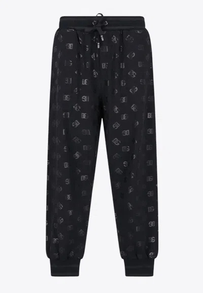 Dolce & Gabbana All-over Dg Logo Print Track Pants In Black