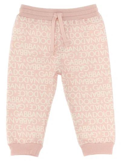 Dolce & Gabbana All Over Logo Joggers In Pink