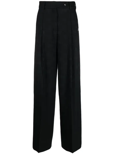 Dolce & Gabbana All-over Logo Print Trousers In Black