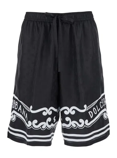 Dolce & Gabbana Black Bermuda Pants With Drawstring Elastic Waist And Maxi Print In Silk Man