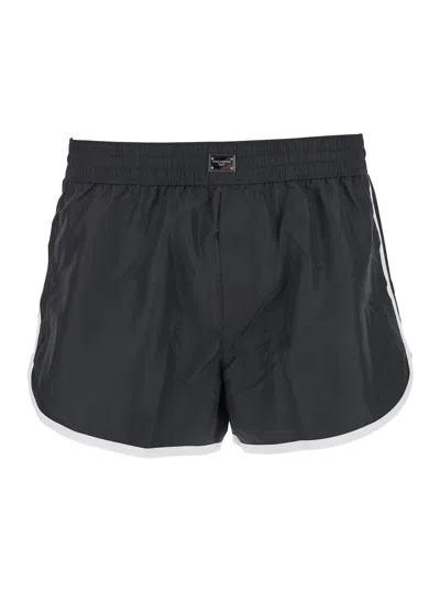 DOLCE & GABBANA DOLCE & GABBANA MEN BLACK SWIMSUIT WITH LOGO PLATE ON THE FRONT IN TECH FABRIC MAN