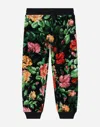 DOLCE & GABBANA CHENILLE JOGGING PANTS WITH ROSE PRINT OVER A BLACK BACKGROUND