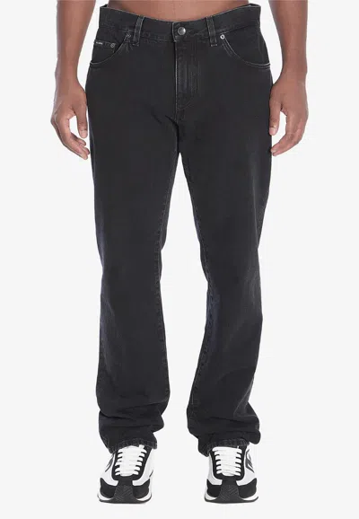 Dolce & Gabbana Denim Pants With Plaque In Black