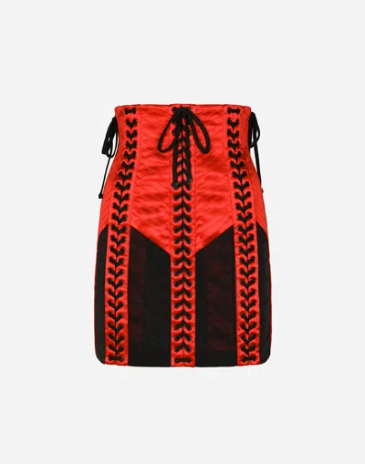 DOLCE & GABBANA CORSET-STYLE MINISKIRT WITH LACES AND EYELETS