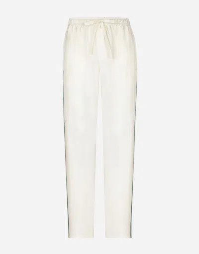 DOLCE & GABBANA SILK JOGGING PANTS WITH DG EMBROIDERY