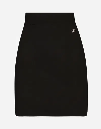 DOLCE & GABBANA SHORT STRETCH VISCOSE KNIT SKIRT WITH DG LOGO