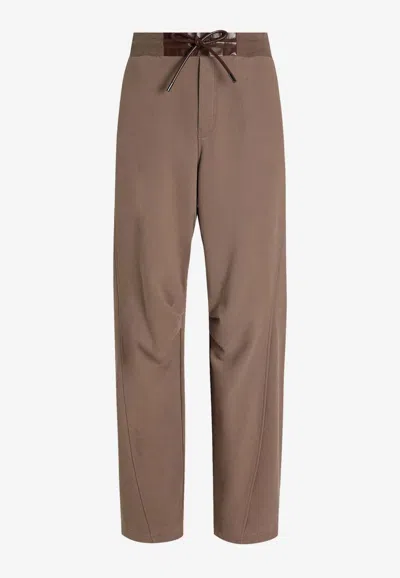 Dolce & Gabbana Dg Logo Patch Track Pants In Brown