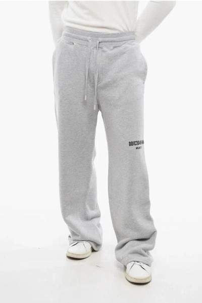 DOLCE & GABBANA DISTRESSED WIDE-LEG JOGGERS WITH GRAPHIC PRINT