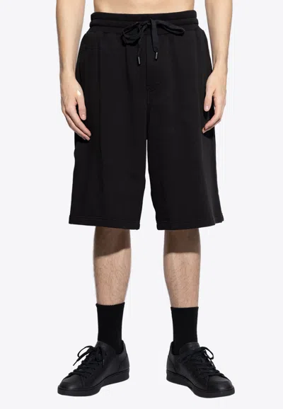 Dolce & Gabbana Embossed Dg Logo Casual Shorts In Black