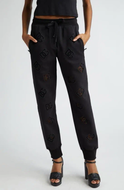 Dolce & Gabbana Eyelet Logo Cotton Blend Joggers In N0000nero