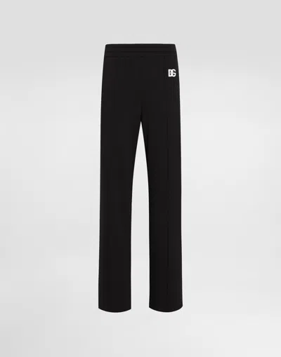Dolce & Gabbana Flared Jersey Jogging Pants With Dg Logo Embroidery In Black