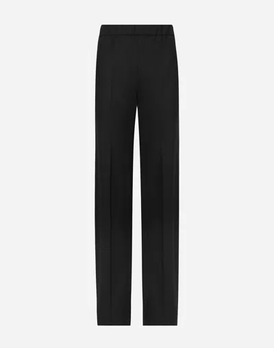 DOLCE & GABBANA FLARED STRETCH WOOL TWILL PANTS