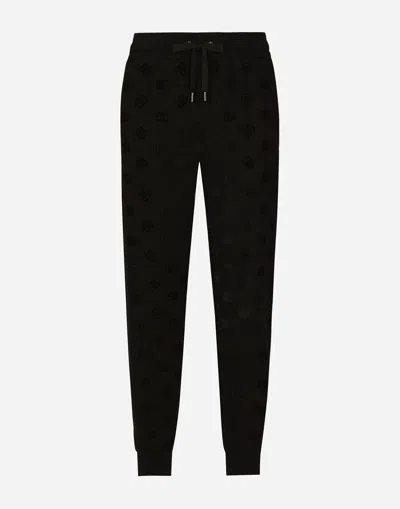 DOLCE & GABBANA JERSEY JOGGING PANTS WITH ALL-OVER DG LOGO PRINT