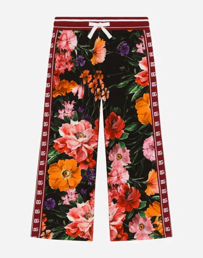 Dolce & Gabbana Jersey Jogging Pants With Floral Print Over A Black Background