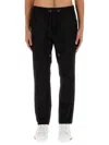 Dolce & Gabbana Jogging Pants With Plaque Detail In Black